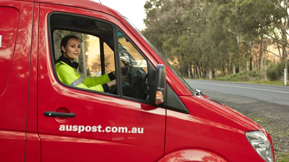 Australia Post van being driven by a female driver.