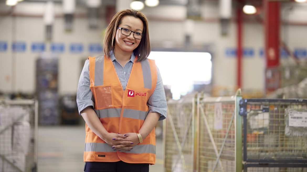 Woman in an Australia Post vest.